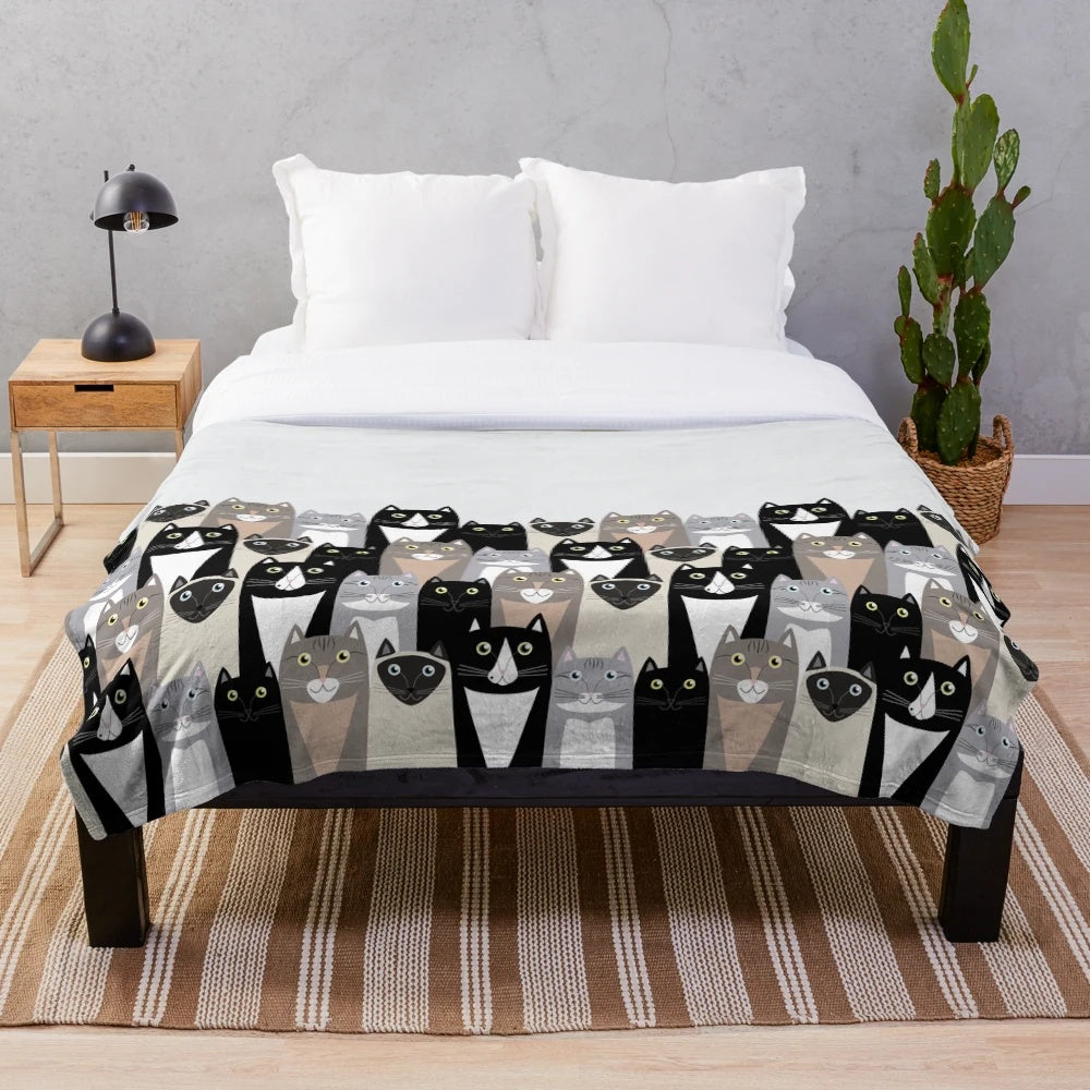 Cozy cat-themed plush blanket featuring cartoon cats in neutral colors