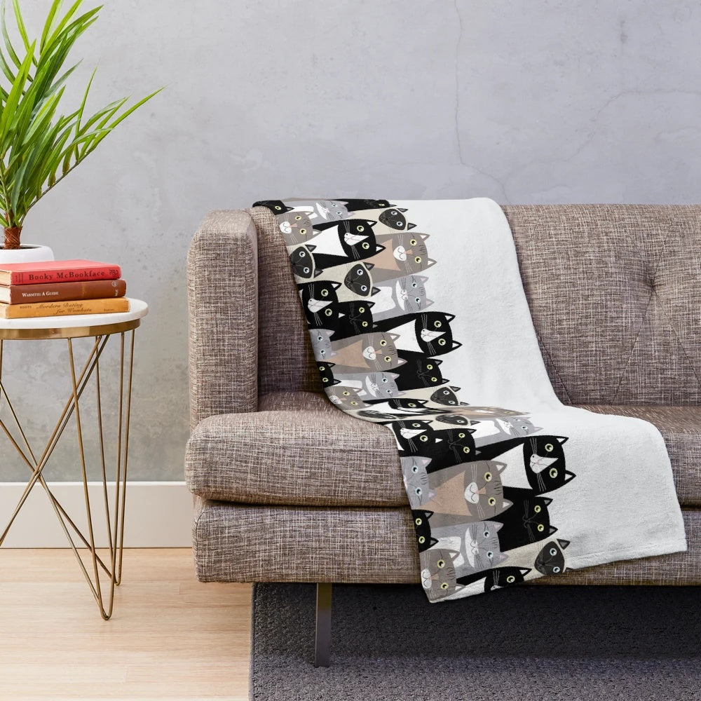 Cozy cat-themed plush blanket featuring cartoon cats in neutral colors