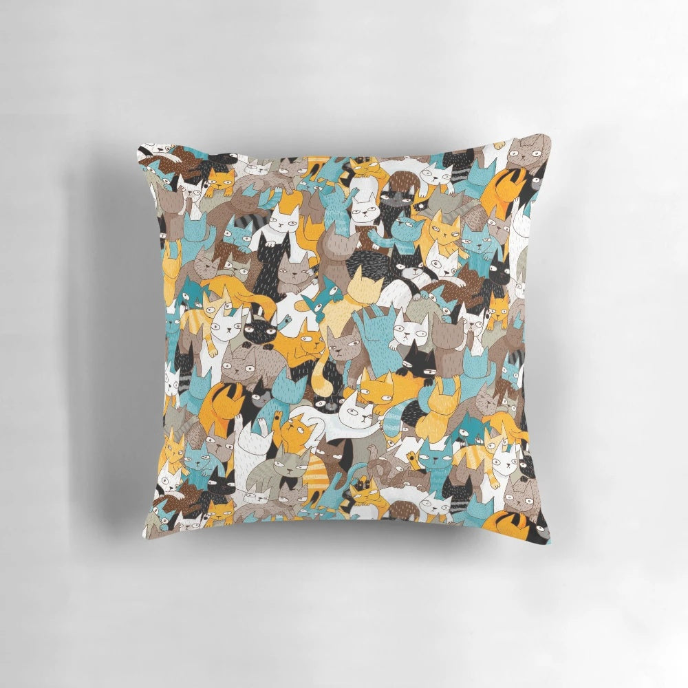 A vibrant, patterned pillow featuring cats and catnip, perfect for cat owners and home decor.