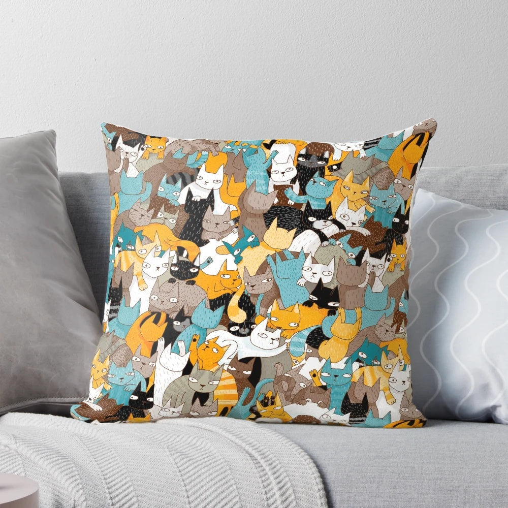 A vibrant, patterned pillow featuring cats and catnip, perfect for cat owners and home decor.