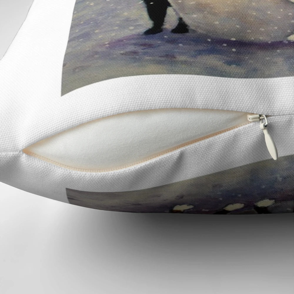A snow-covered pillow featuring a cute black or tortoiseshell cat in a winter wonderland with a snowman.