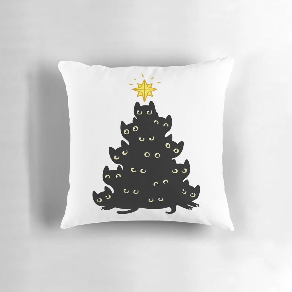 A cozy cat-themed Christmas pillow with a black cat silhouette against a Christmas tree design.