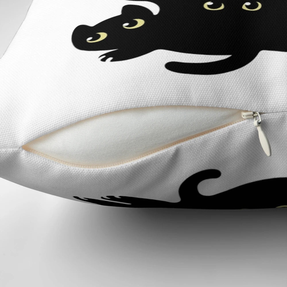 A cozy cat-themed Christmas pillow with a black cat silhouette against a Christmas tree design.