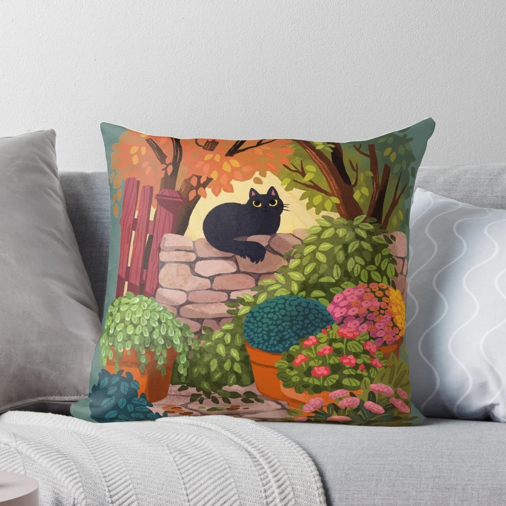 A whimsical pillow featuring a cat sitting in a garden with flowers and plants