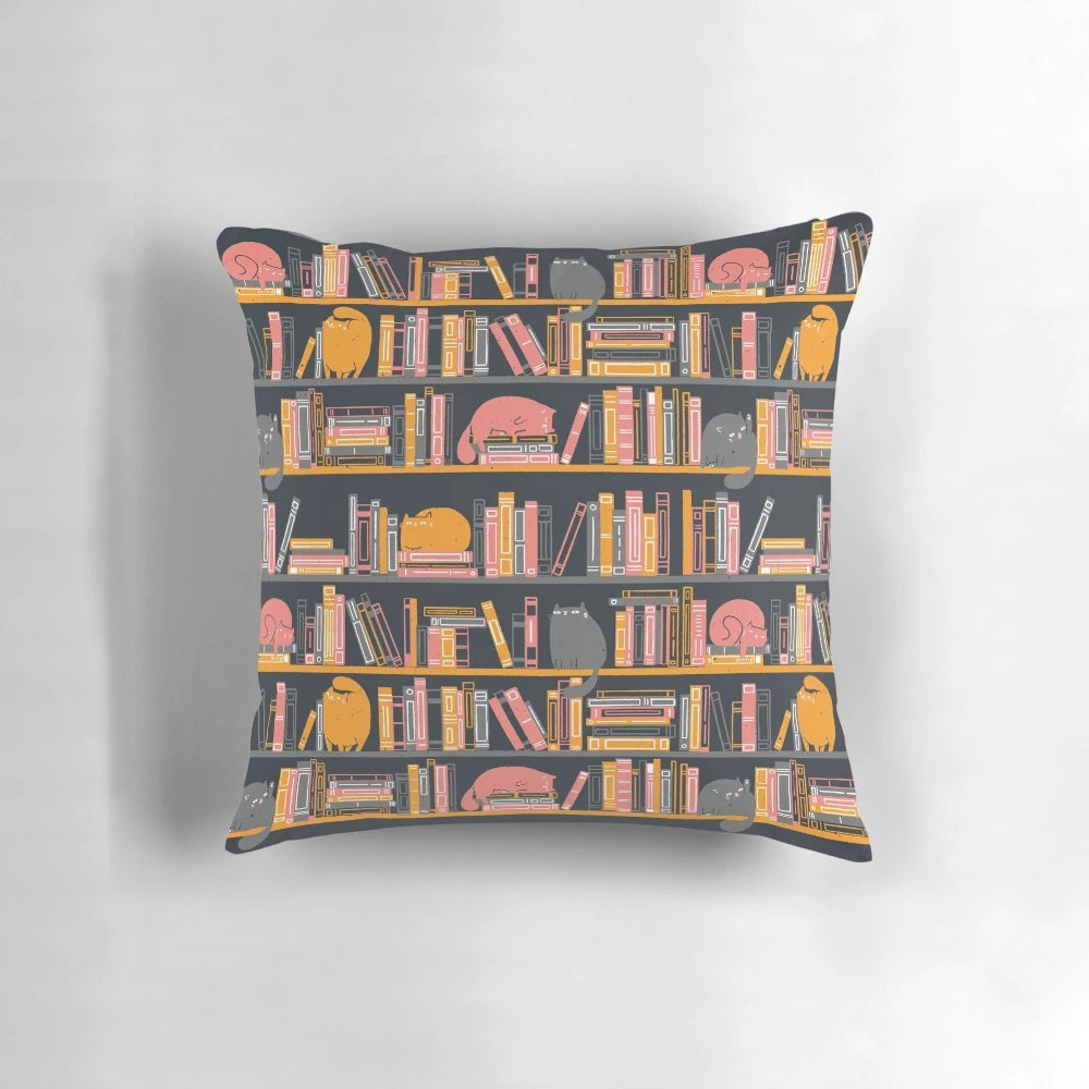 Soft and snuggly cat-themed pillow featuring a cat lounging on a bookshelf