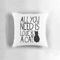 Soft, plush pillow with the text "All You Need Is Love and A Cat" printed on it