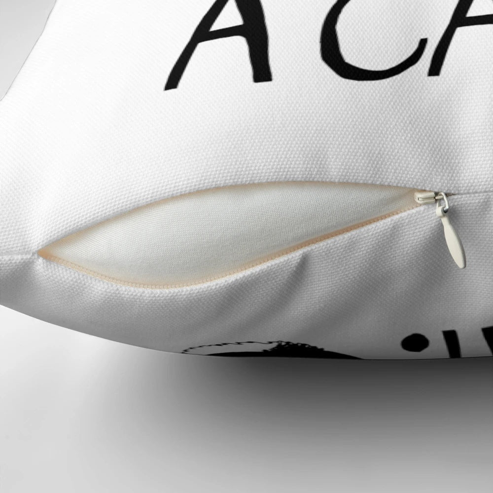 Soft, plush pillow with the text "All You Need Is Love and A Cat" printed on it