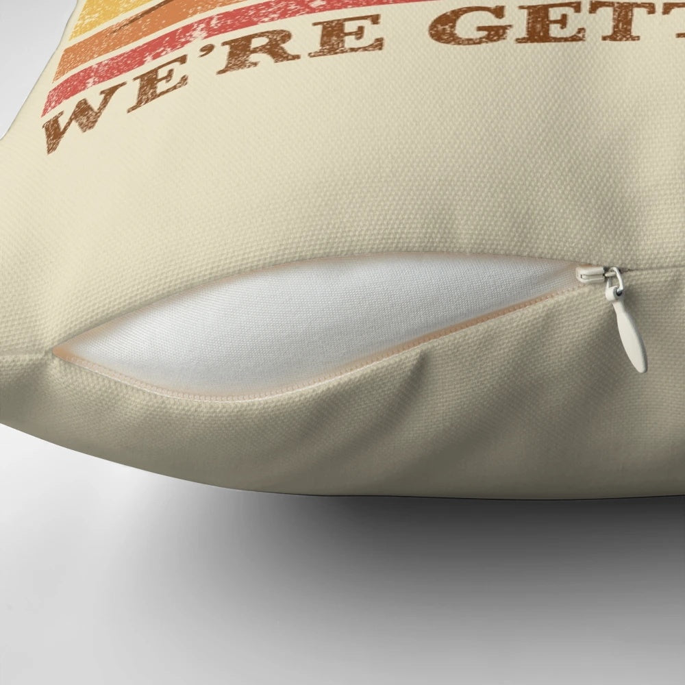 A cozy, vintage-inspired pillow featuring a playful "Get in Loser, We're Getting Tacos" design with cats and tacos.