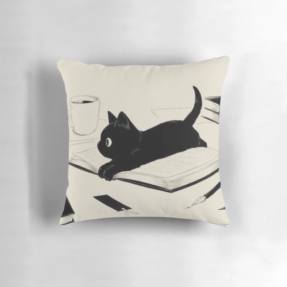 A soft, plush cat-shaped pillow in a black and neutral color scheme, perfect for cat lovers and adding a touch of coziness to any space.