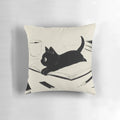 A soft, plush cat-shaped pillow in a black and neutral color scheme, perfect for cat lovers and adding a touch of coziness to any space.