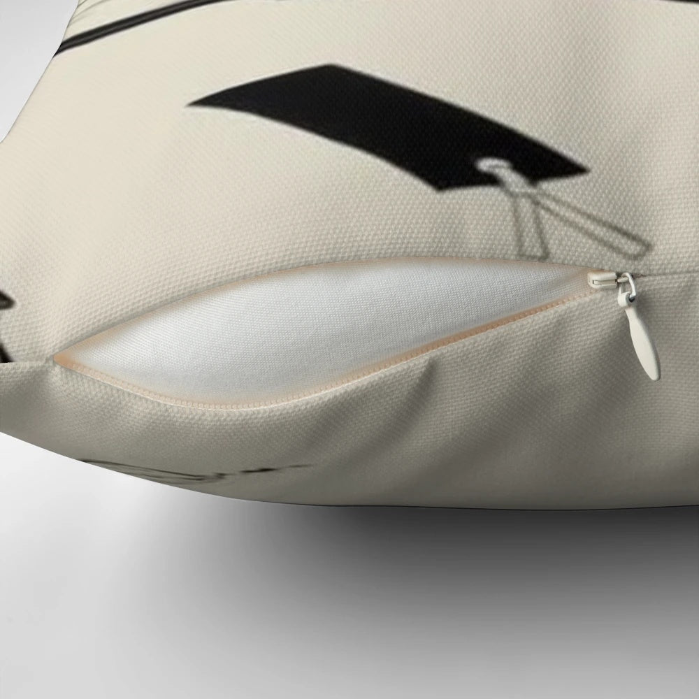 A soft, plush cat-shaped pillow in a black and neutral color scheme, perfect for cat lovers and adding a touch of coziness to any space.