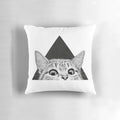 A fluffy black and white cat sleeping peacefully on a soft, plush pillow
