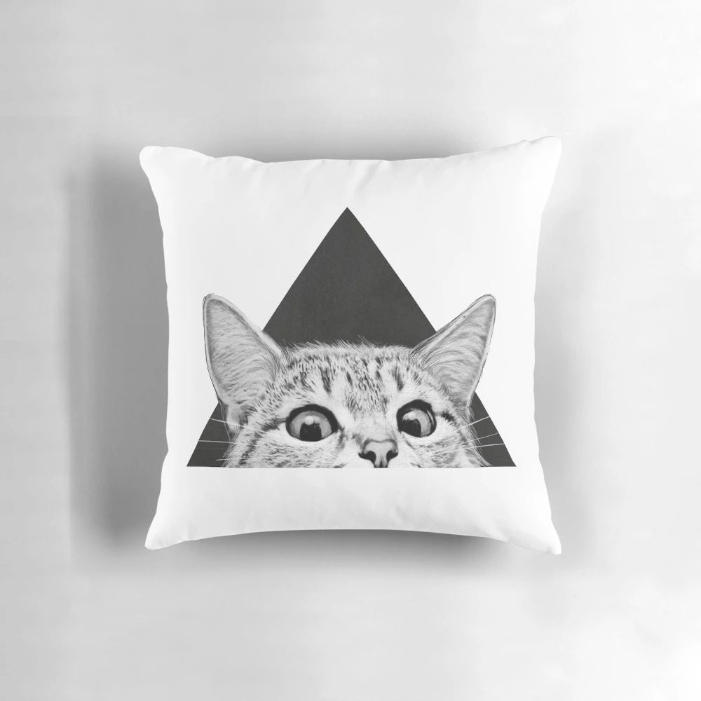 A fluffy black and white cat sleeping peacefully on a soft, plush pillow