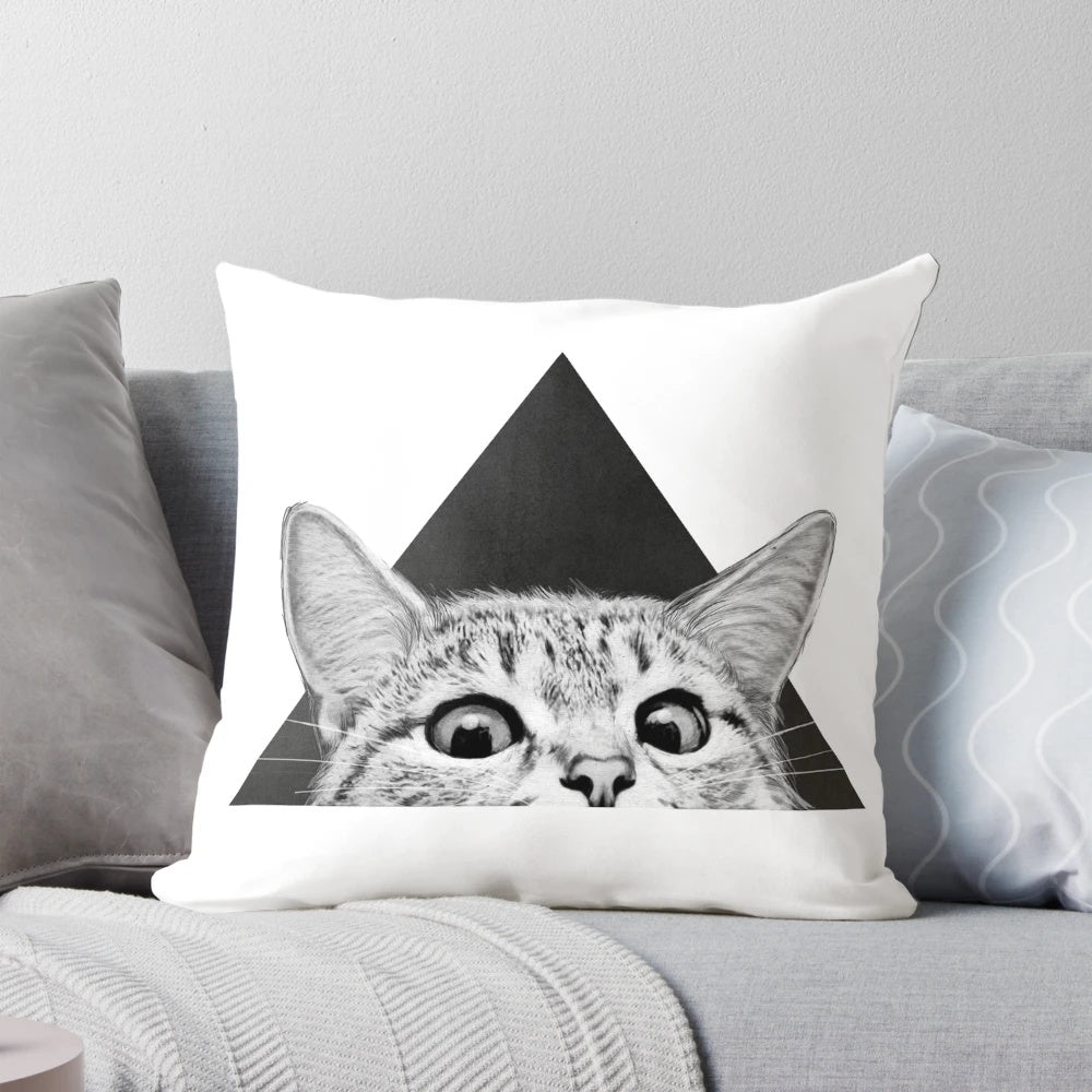 A fluffy black and white cat sleeping peacefully on a soft, plush pillow