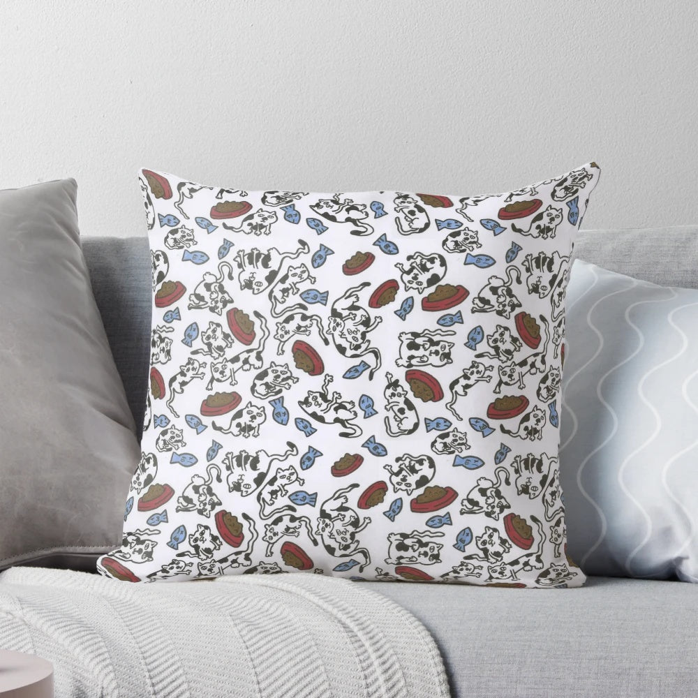 A soft, plush pillow featuring a pattern of adorable cats and felines in various colors and poses.