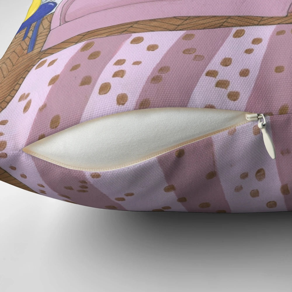Decorative cat pillow featuring a black, tuxedo, and ginger cat lounging on a pink sofa