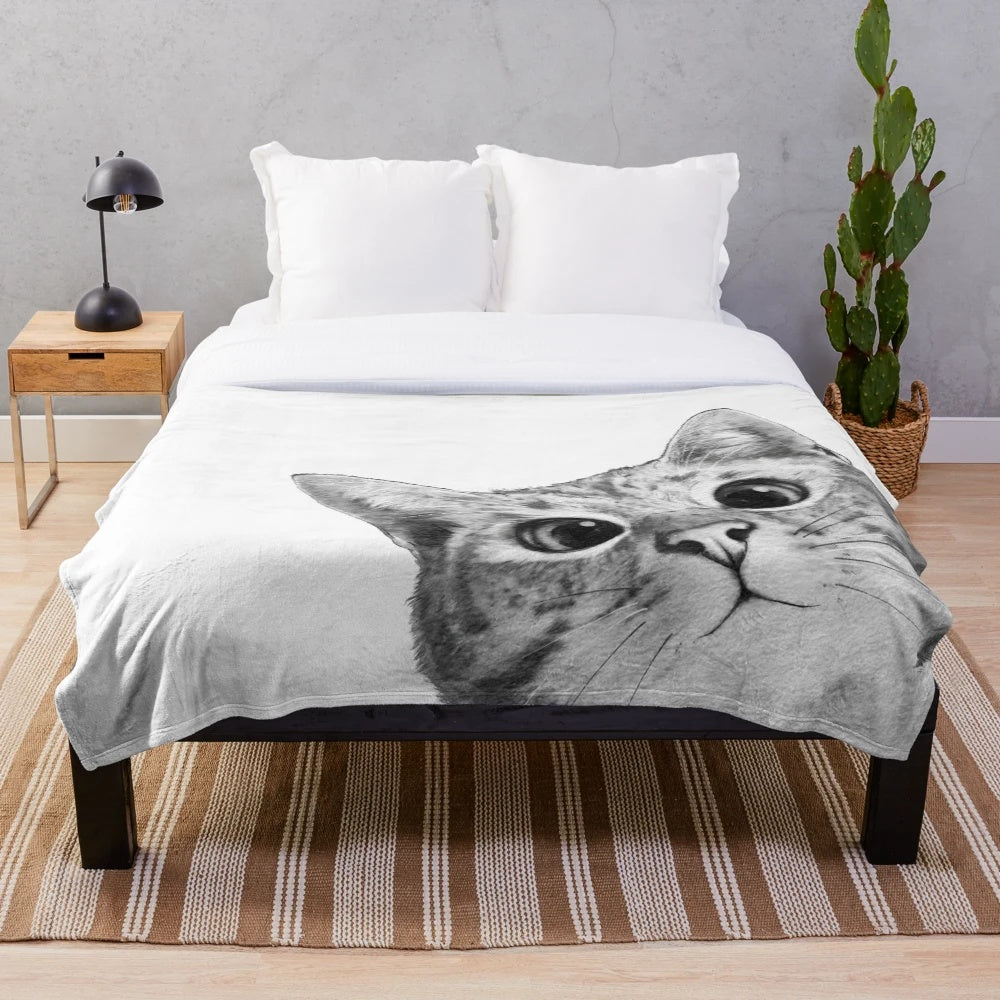 Soft and cuddly cat plush blanket featuring a playful peekaboo design