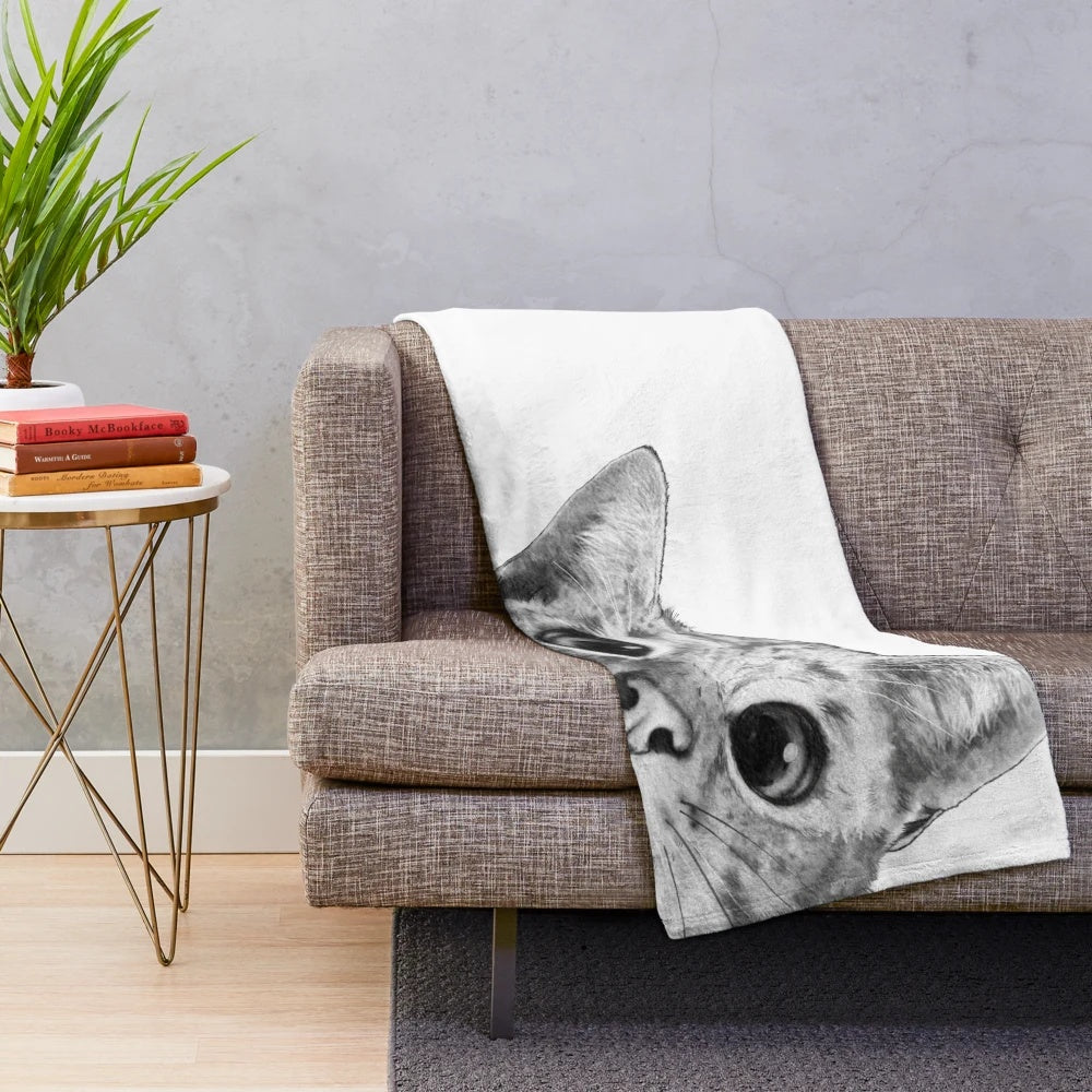 Soft and cuddly cat plush blanket featuring a playful peekaboo design