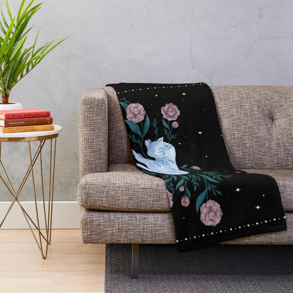 Plush blanket featuring a cat dreaming of the moon in a magical night garden