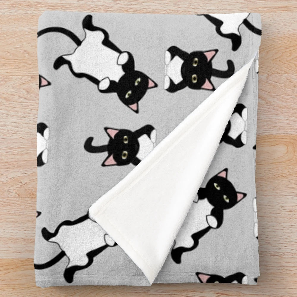 Fluffy plush blanket with a lazy black cat pattern design