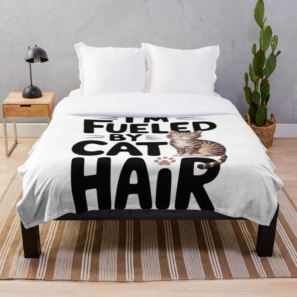 Soft and cuddly plush blanket with a cute cat design