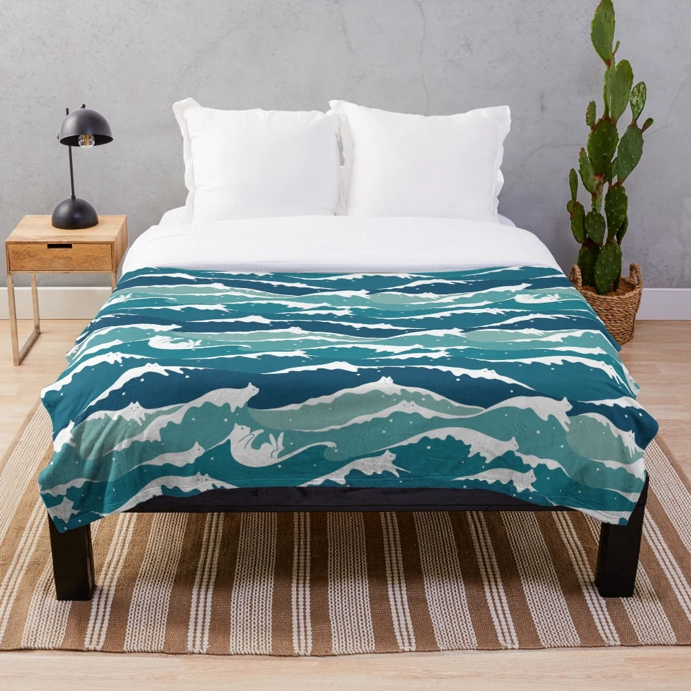 Soft plush cat blanket with blue waves and ocean design