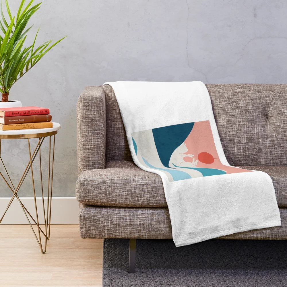 Soft and plush blanket featuring a colorful cat design