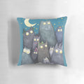 A soft, decorative pillow featuring a colorful design of cats, moons, and stars, perfect for adding a touch of feline fun to your home.