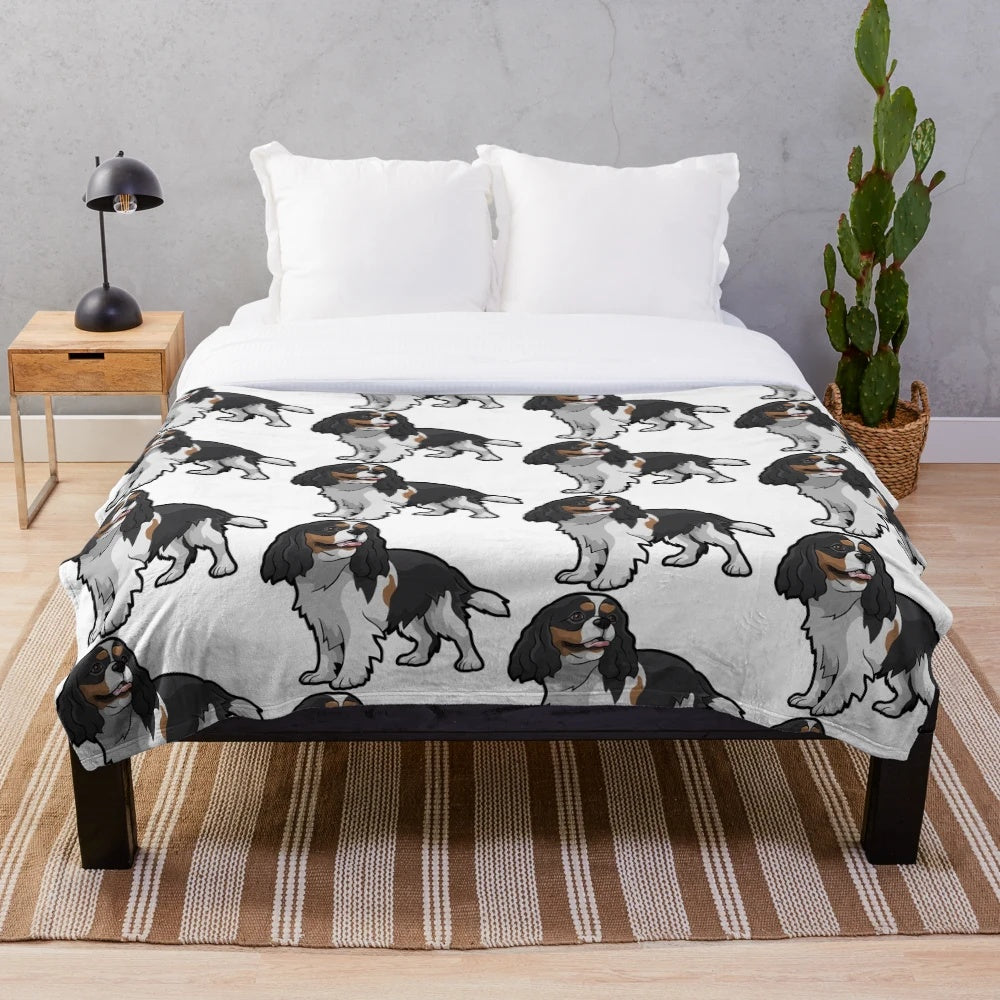 Cavalier King Charles Spaniel curled up on a soft, plush blanket