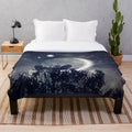 Plush blanket featuring a night sky design with planets and stars