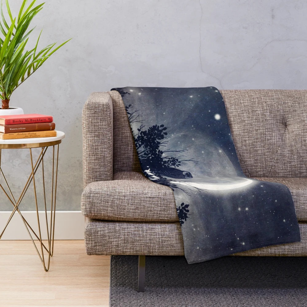 Plush blanket featuring a night sky design with planets and stars