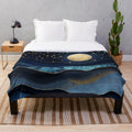 Cozy plush blanket with golden moon and starry night design