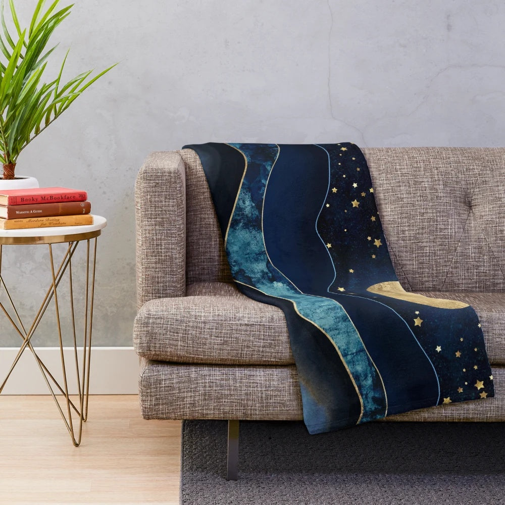 Cozy plush blanket with golden moon and starry night design