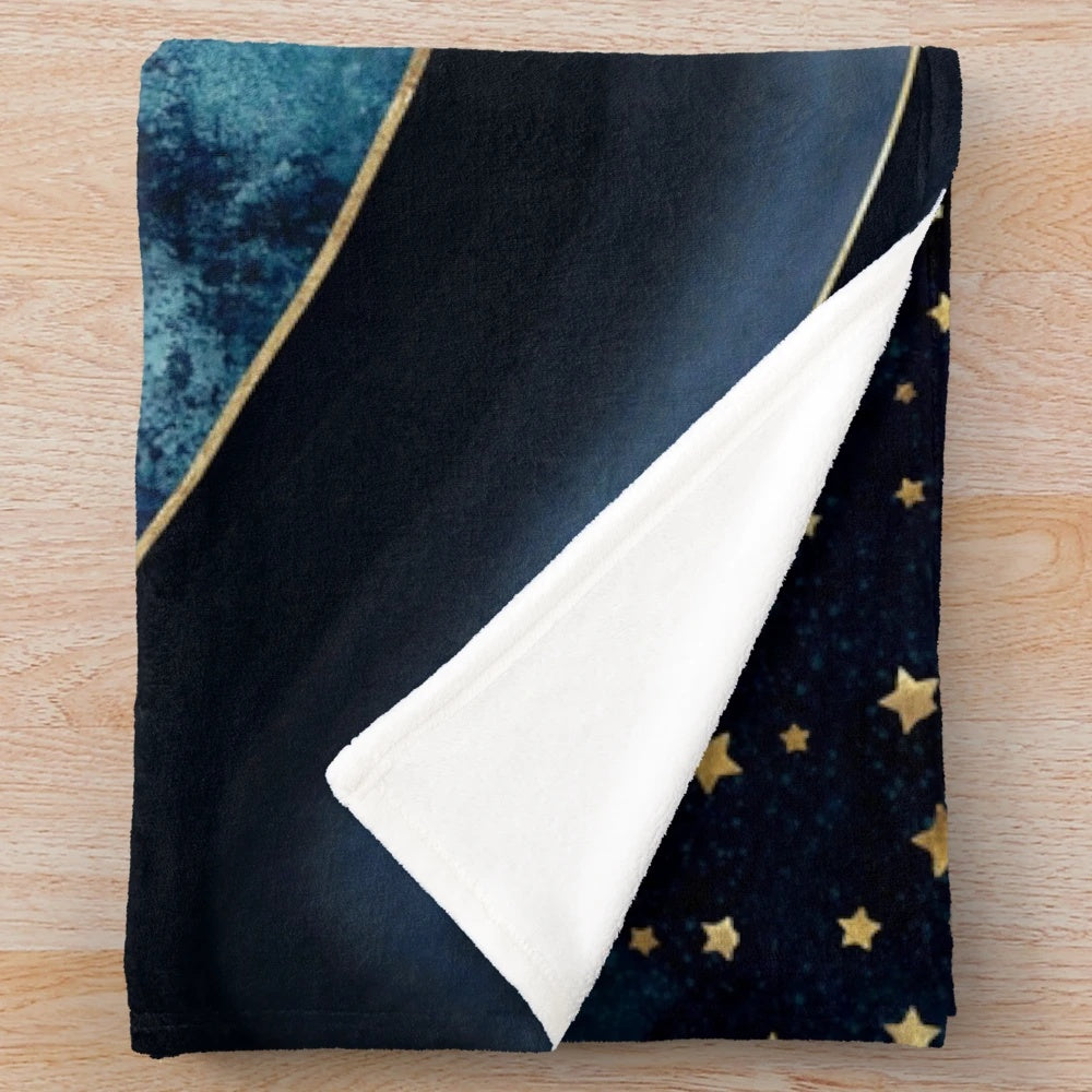 Cozy plush blanket with golden moon and starry night design