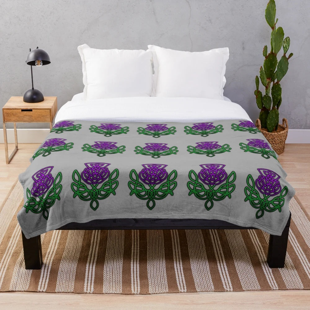 Soft, plush blanket featuring a beautiful celtic thistle floral pattern in green and purple colors
