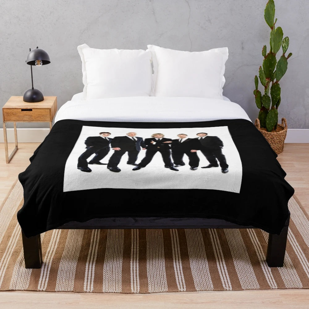 Celtic Thunder-inspired plush blanket with Celtic knot and logo design