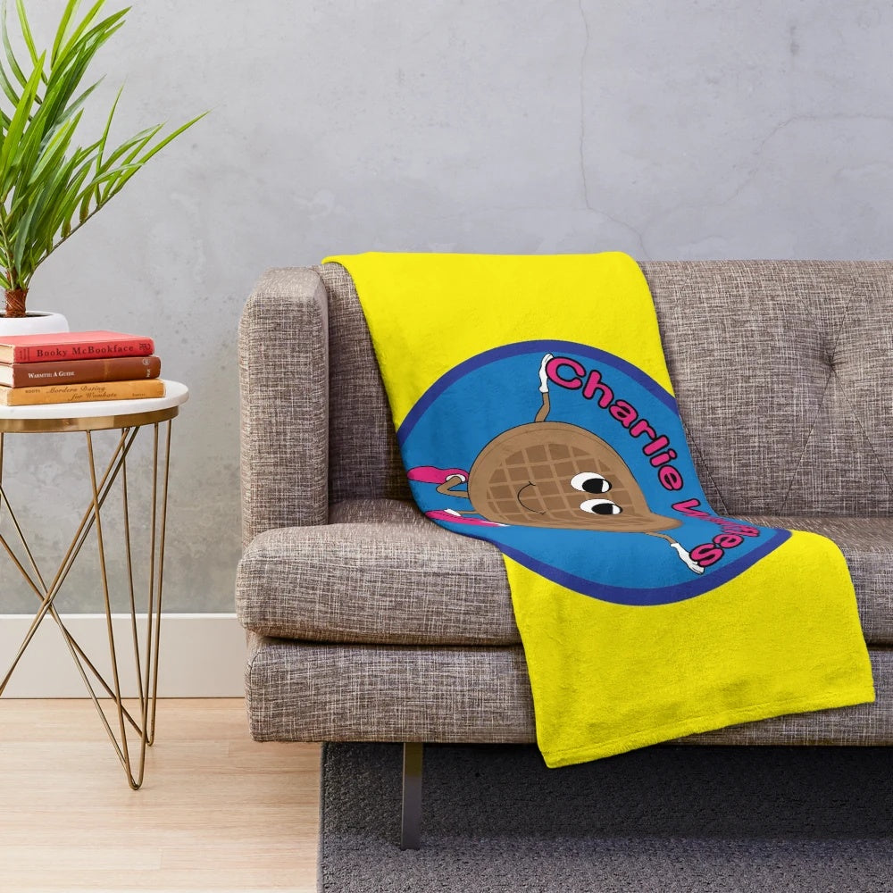 Soft, plush blanket featuring a playful Charlie Waffles design