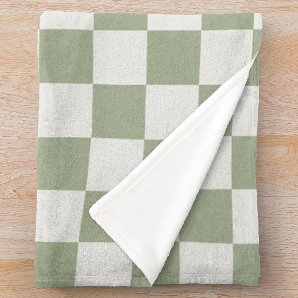 Soft and textured plush blanket with a checkerboard pattern in sage green and off white