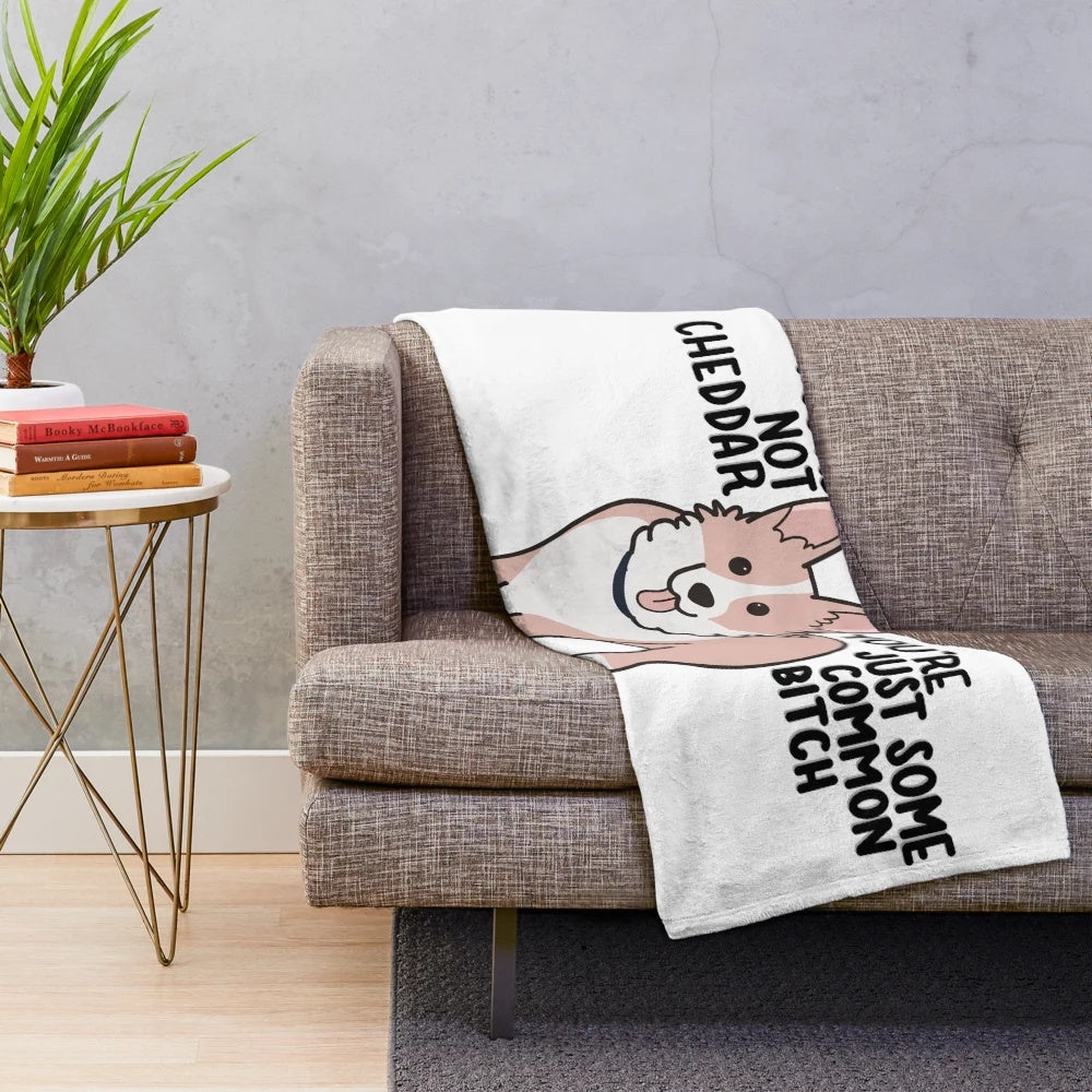 Soft, cuddly plush blanket featuring a cheddar-colored corgi, inspired by the TV show Brooklyn Nine-Nine