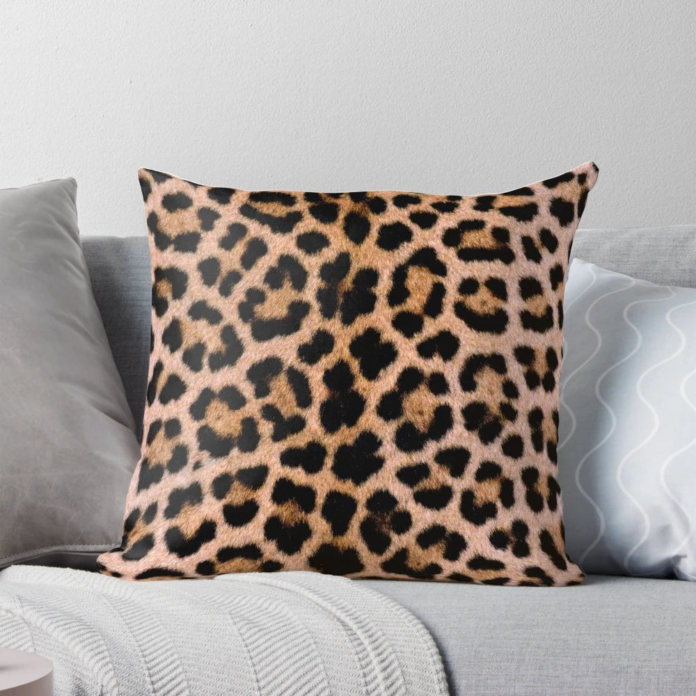 Cheetah print pillow with soft, plush fabric and vibrant brown and tan colors