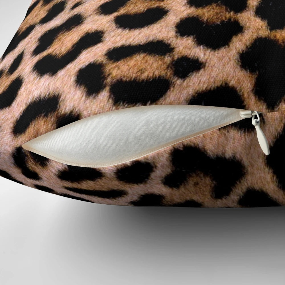 Cheetah print pillow with soft, plush fabric and vibrant brown and tan colors