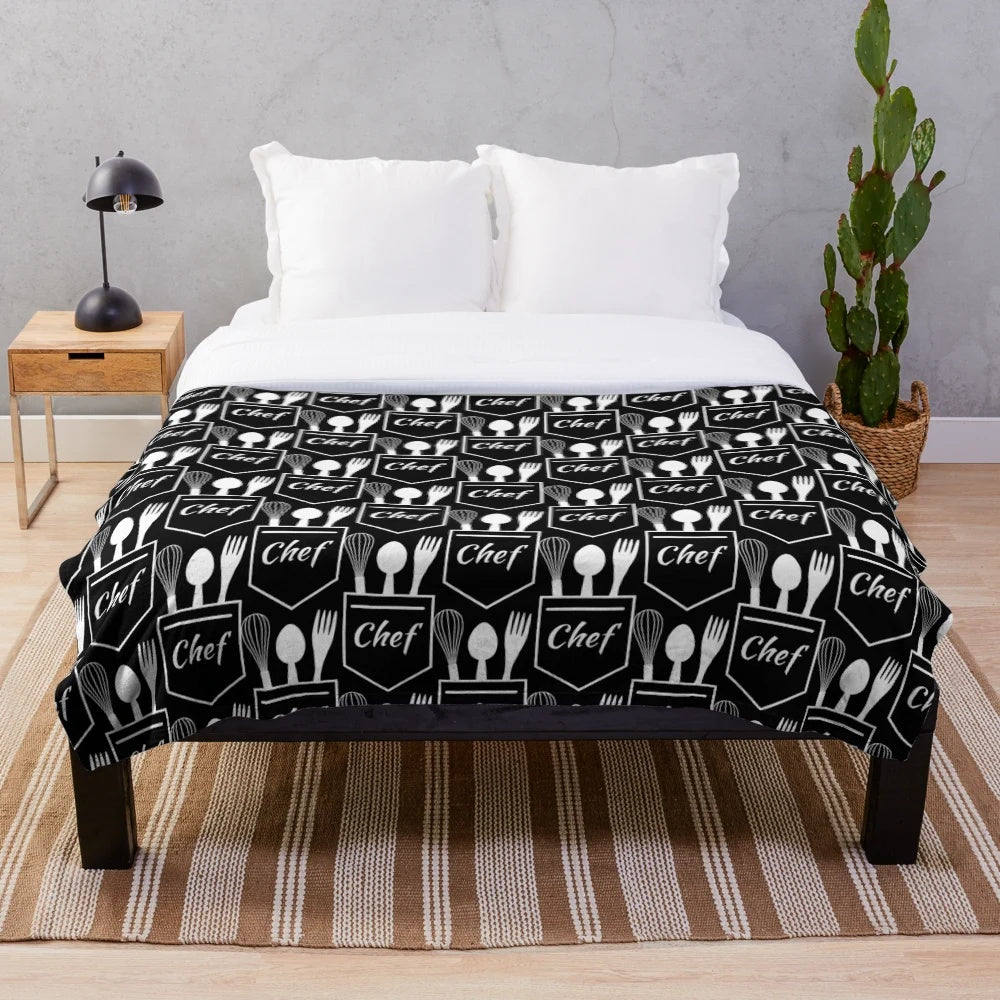 Plush blanket with chef's pocket utensils design
