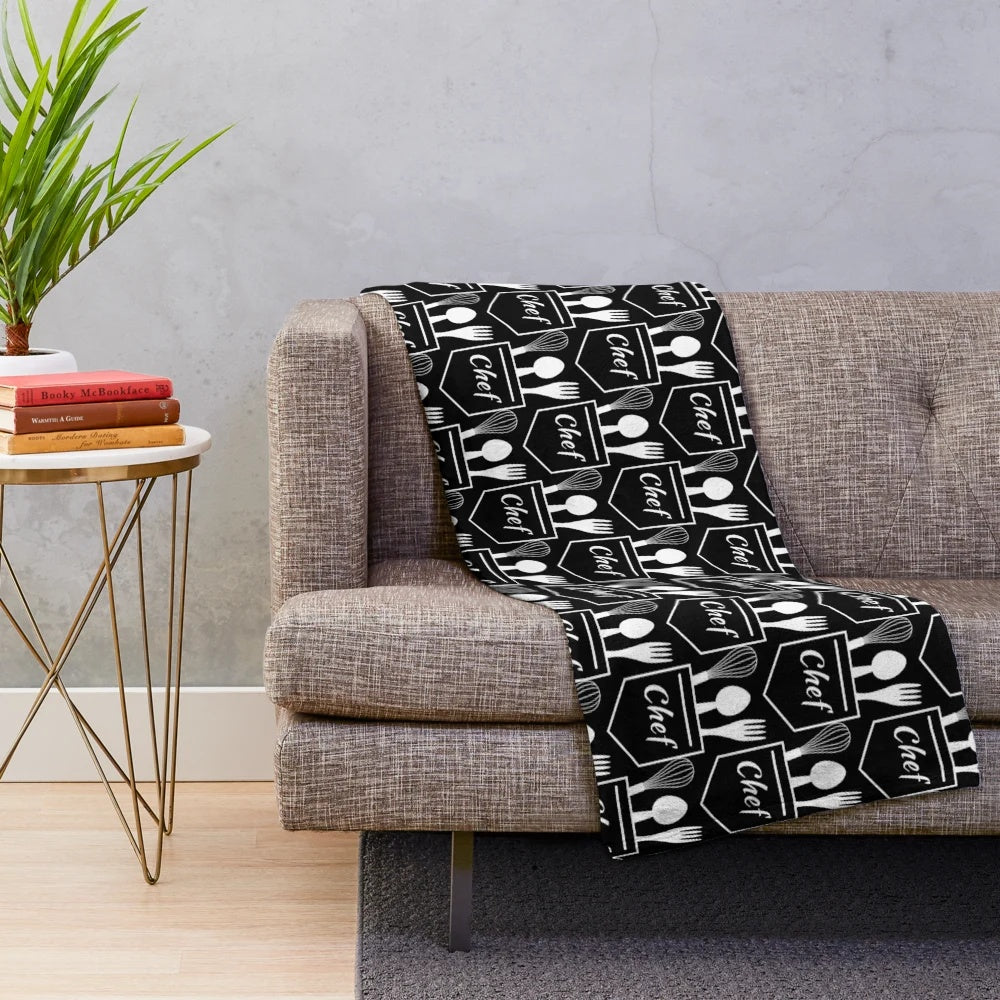 Plush blanket with chef's pocket utensils design