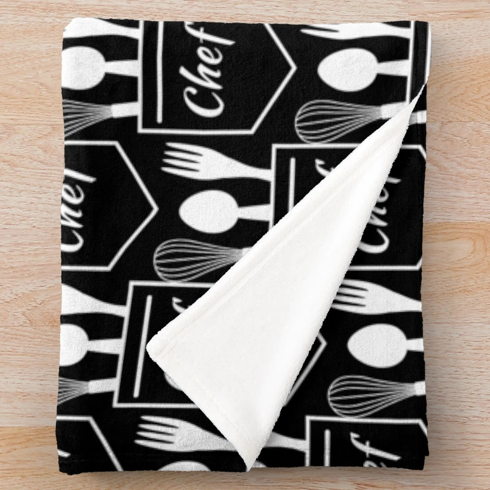 Plush blanket with chef's pocket utensils design