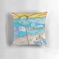 Coastal-inspired decorative pillow featuring an ocean and beach scene