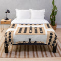 Plush blanket featuring chess pieces and chess board design