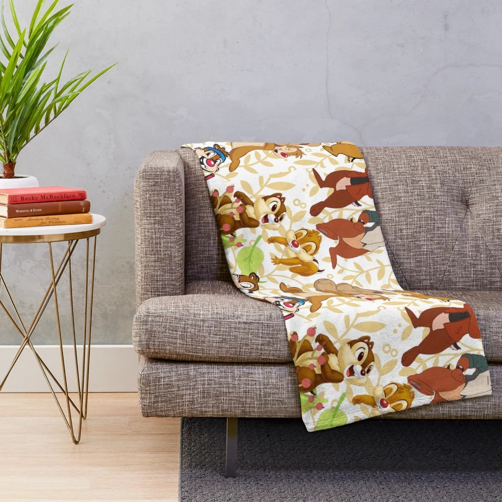 Colorful plush blanket featuring a whimsical chipmunk inspired design