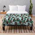 Chocolate Labrador Retriever Curled up on a Tropical Plush Blanket