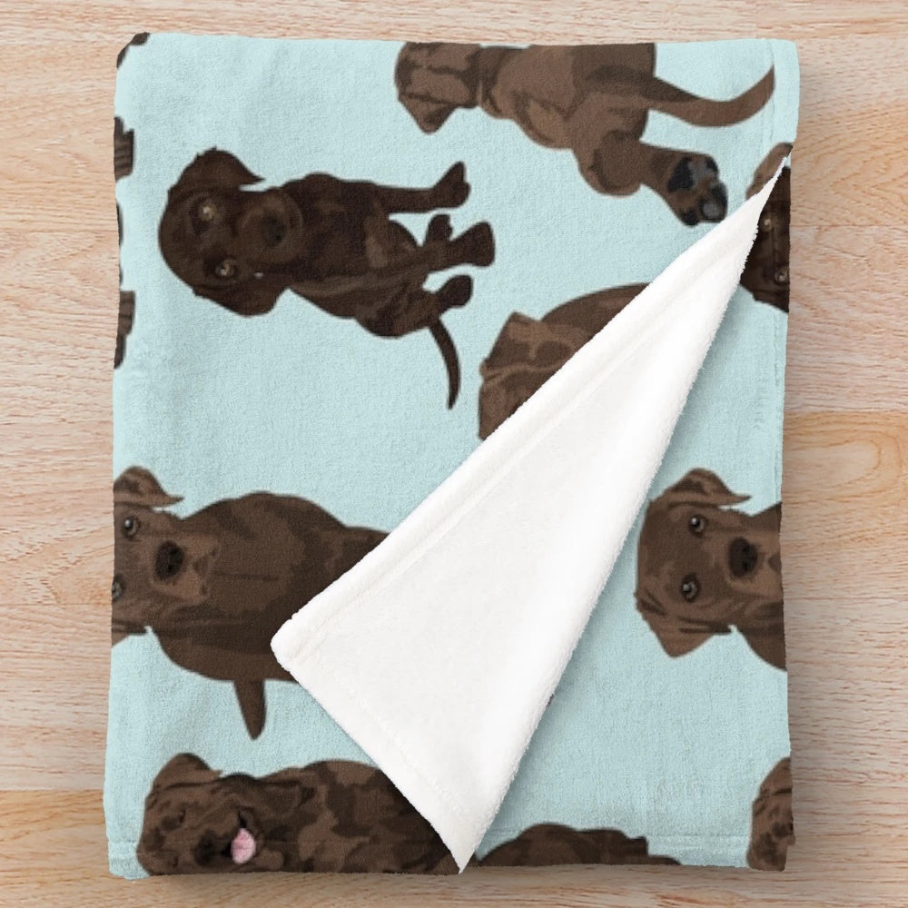 Chocolate Labrador Retriever Puppy Curled Up on Soft, Plush Blanket