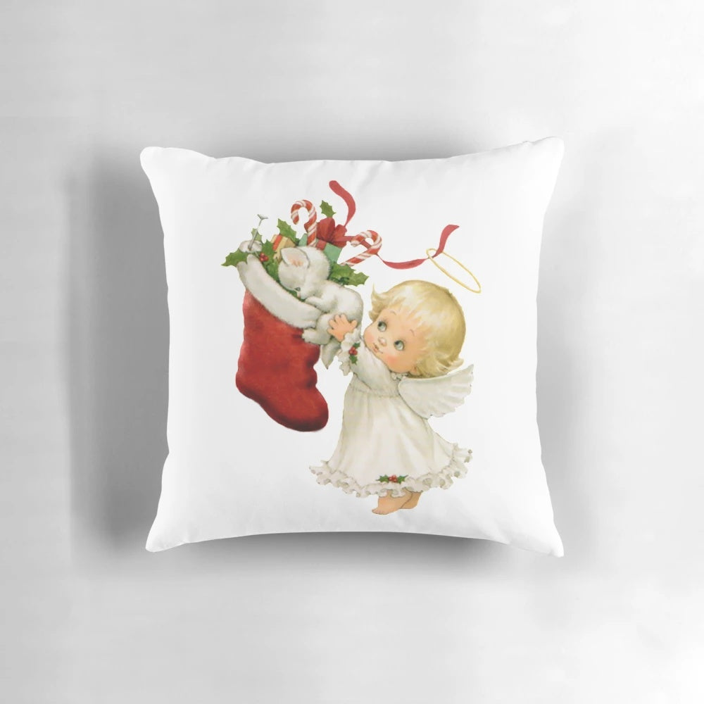 A soft, white Christmas angel pillow with a cuddly kitten design, perfect for festive holiday home decor.